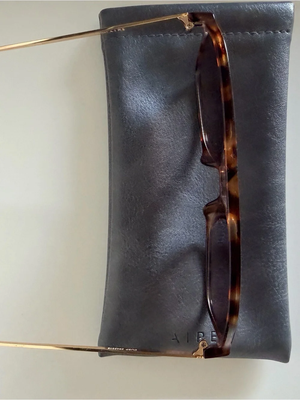 Aire Cusp Sunglasses in Dark Torte, Gold, and Dark Brown Gradient
